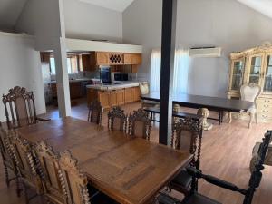 a dining room with a wooden table and chairs at Mountain Hideway in Coarsegold