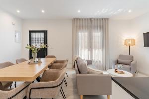 a dining room with a table and chairs at Los Naranjos House in Marbella
