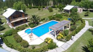 an aerial view of a house with a swimming pool at Mariaflorales in San Rafael