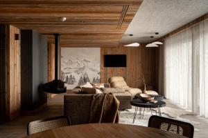 a living room with a couch and a table at Gorczański Lux Chalet in Szlembark