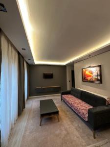 a living room with a couch and a table at Tree Rose Suite in Uzungöl