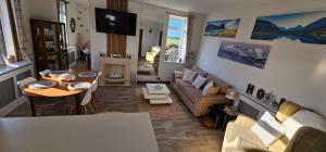 a living room with a table and a couch at Westview in Buckie