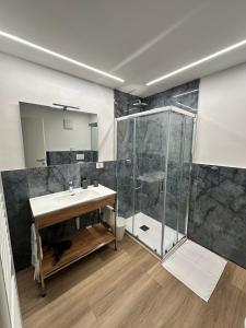 a bathroom with a shower and a sink at B&B Piano B in Riva del Garda
