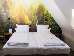 Giường trong phòng chung tại Hotel Restaurant Anders