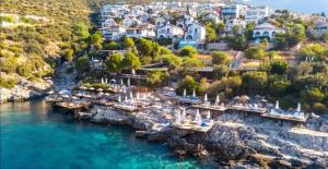 an aerial view of a resort on the water at Grand süit in Kalkan