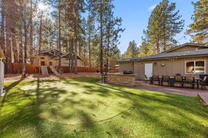 a yard with a barbecue grill and a house at Rare Indoor Pool, Game Room & Courts, 5 Blocks to Snow Summit in Big Bear Lake