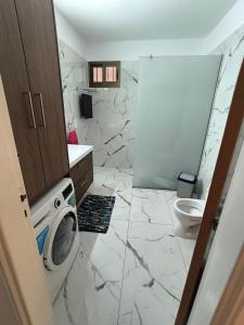 a bathroom with a toilet and a sink at Eva Luxury Apartment in Paphos +5 photos