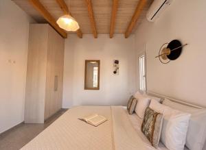 a bedroom with a large bed in a room at Klima Breeze in Klíma +19 photos