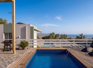 a house with a swimming pool on a deck at Klima Breeze in Klíma