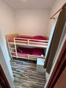a room with two bunk beds on the floor at Bambusz76 in Zamárdi