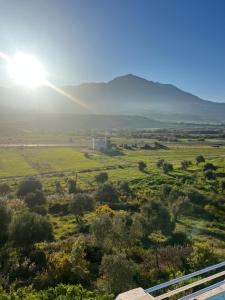 a view of a field with the sun in the sky at Olea Azul in Chefchaouen
