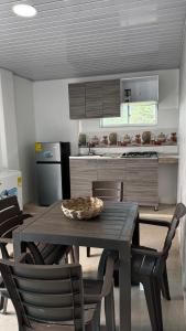 a kitchen with a table and chairs in a kitchen at Old Providence Paradise View in Providencia