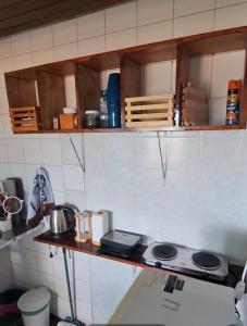 a kitchen with a stove and a counter top at Chalet da Bela Vista in Itamaracá