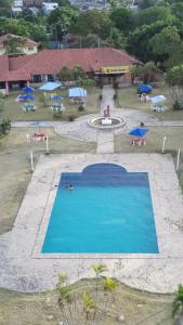 an overhead view of a swimming pool in a resort at Chalet da Bela Vista in Itamaracá +7 photos
