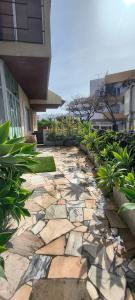 a stone walkway in front of a building at 3B flat in Portimão