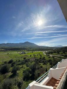 a view from the balcony of a house with mountains in the background at Olea Azul in Chefchaouen