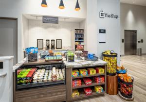 a grocery store counter with food on display at Hilton Garden Inn- Chicago Central Loop in Chicago
