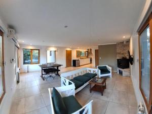 a living room with a couch and a table at Casa Golf in Sierra de los Padres