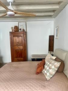 a bedroom with a bed with a ceiling fan at Good Vibes in Grenoble