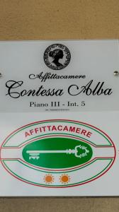 a sign for an albuquerqueaccoaccoaccoaccoaccoaccoaccoaccoacco at Contessa Alba in Savona