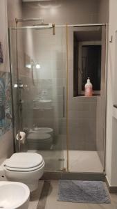 a bathroom with a shower with a toilet and a sink at Contessa Alba in Savona