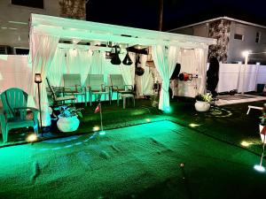 a backyard with a white gazebo at night at Sunset by the Sea 3054 in Fort Myers Beach +32 photos