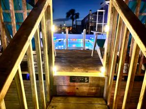 a stairway with a sign that reads stairs to a pool at Sunset by the Sea 3054 in Fort Myers Beach