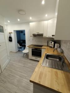 a kitchen with a sink and a counter top at MoRze MielNo in Mielno