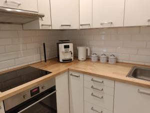 a kitchen with a counter top with a coffee maker at MoRze MielNo in Mielno