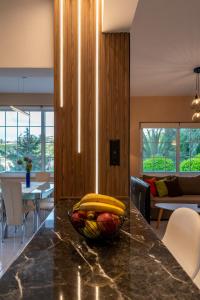 a bowl of fruit on a counter in a kitchen at Monte Mare Rhodes in Ixia +23 photos