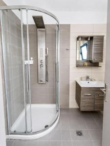 a bathroom with a shower and a sink at Mochlos Studios in Mochlos