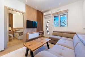 a living room with a couch and a table at Horizon Apartments in Prčanj +18 photos