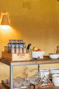 a shelf with a bunch of dishes on it at Mas Escarrà in Caldes de Malavella