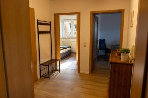 a room with a hallway with a mirror and a door at Auszeit im Sauerland in Meschede