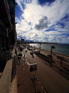 a view of a city street with the ocean at Fouad Hotel in Alexandria