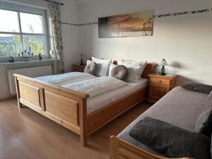 a bedroom with two beds and a window at Ferienhaus Heidi in Lam