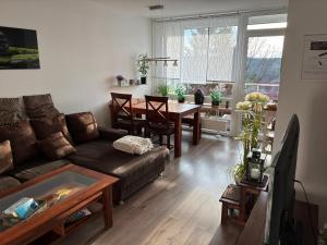 a living room with a couch and a table at FeWo Altenau in Altenau