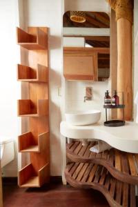 a bathroom with a tub and a sink at Sohla Hotel Popoyo in Playa Santana