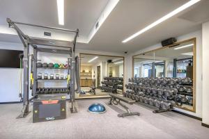 a room with a gym with a lot of equipment at The Key Hotel Dubuque, Tapestry Collection By Hilton in Dubuque