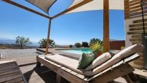a patio with a bench and a pool at Casa Gaïa in Borge