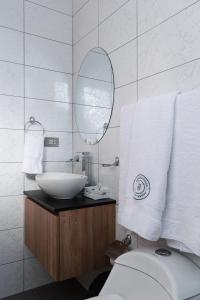 a bathroom with a sink and a toilet and a mirror at Andari Hoteles in Arequipa +67 photos