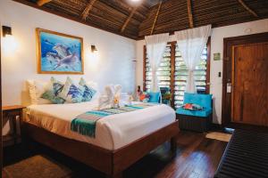a bedroom with a large bed in a room at Azure Del Mar in Maya Beach +166 photos