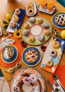 a wooden table with plates of food on it at B&B Zia Bianca in Vietri sul Mare