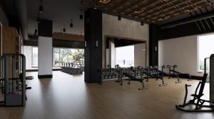 a gym with rows of exercise equipment in a room at The Lakeview Guesthouse in Duluth