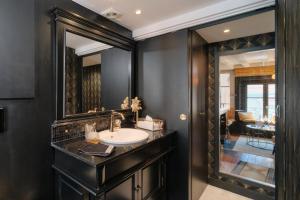 a bathroom with a sink and a mirror at Le Boudoir in Lyon +38 photos
