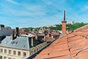 a view of a city from the roof of a building at Le Boudoir in Lyon