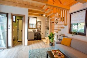 a living room with a couch and a table at B&B Plitvice Holiday Lodge in Plitvička Jezera