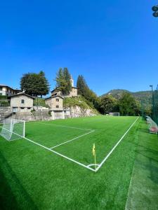 a soccer field with a goal in the middle at Casa Aurea Lake Como Apartment in Esino Lario