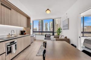 an apartment kitchen and living room with a large window at Beautiful Miami Apt Pool & Beach for 3 Guests in Miami