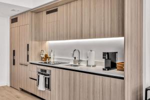 a kitchen with a sink and a stove at Beautiful Miami Apt Pool & Beach for 3 Guests in Miami +49 photos